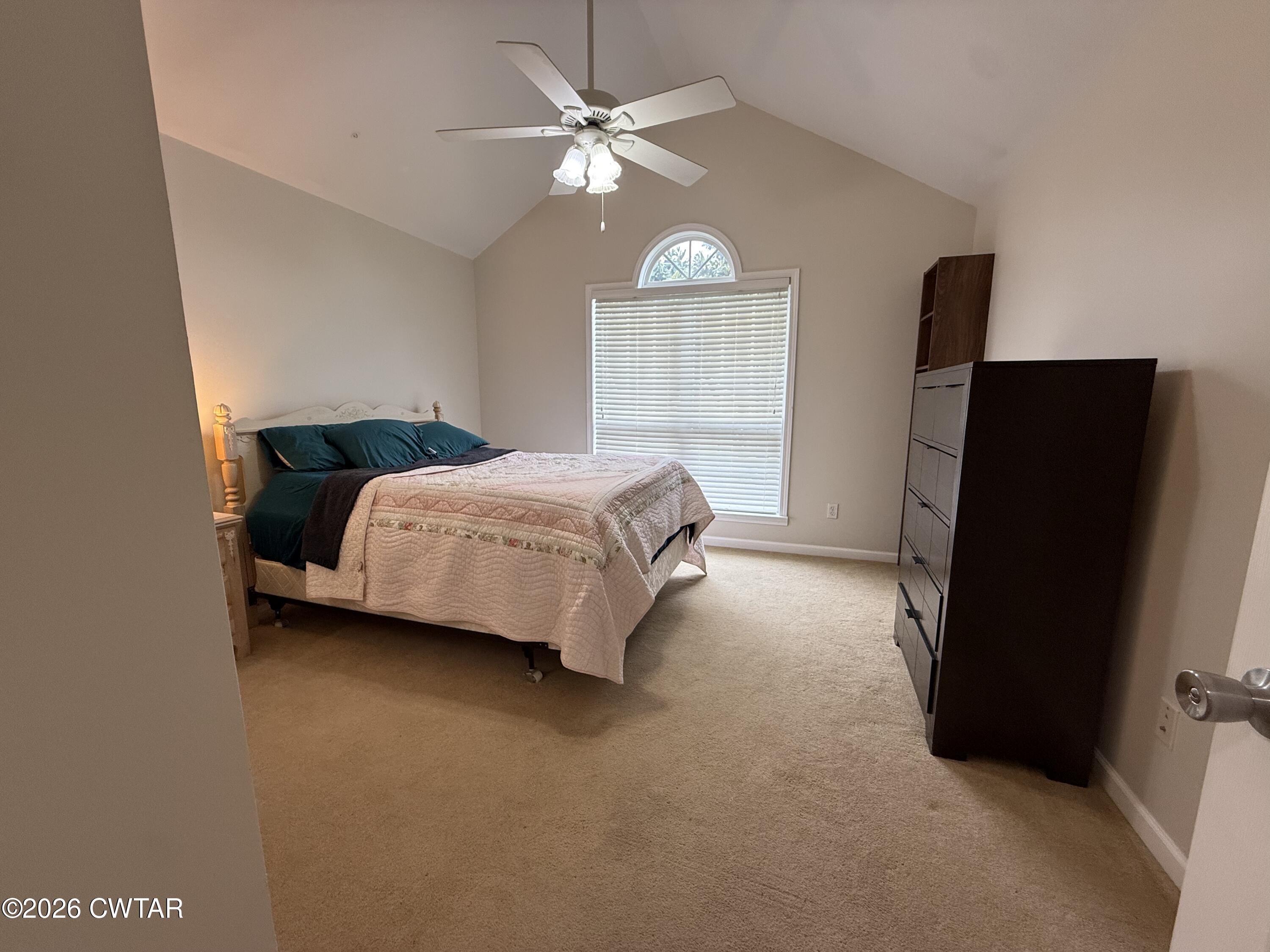 126 Waldunn Cove Rutherford, TN 38369 - Photo 11 of 18 a living room with a bed furniture and a flat tv screen
