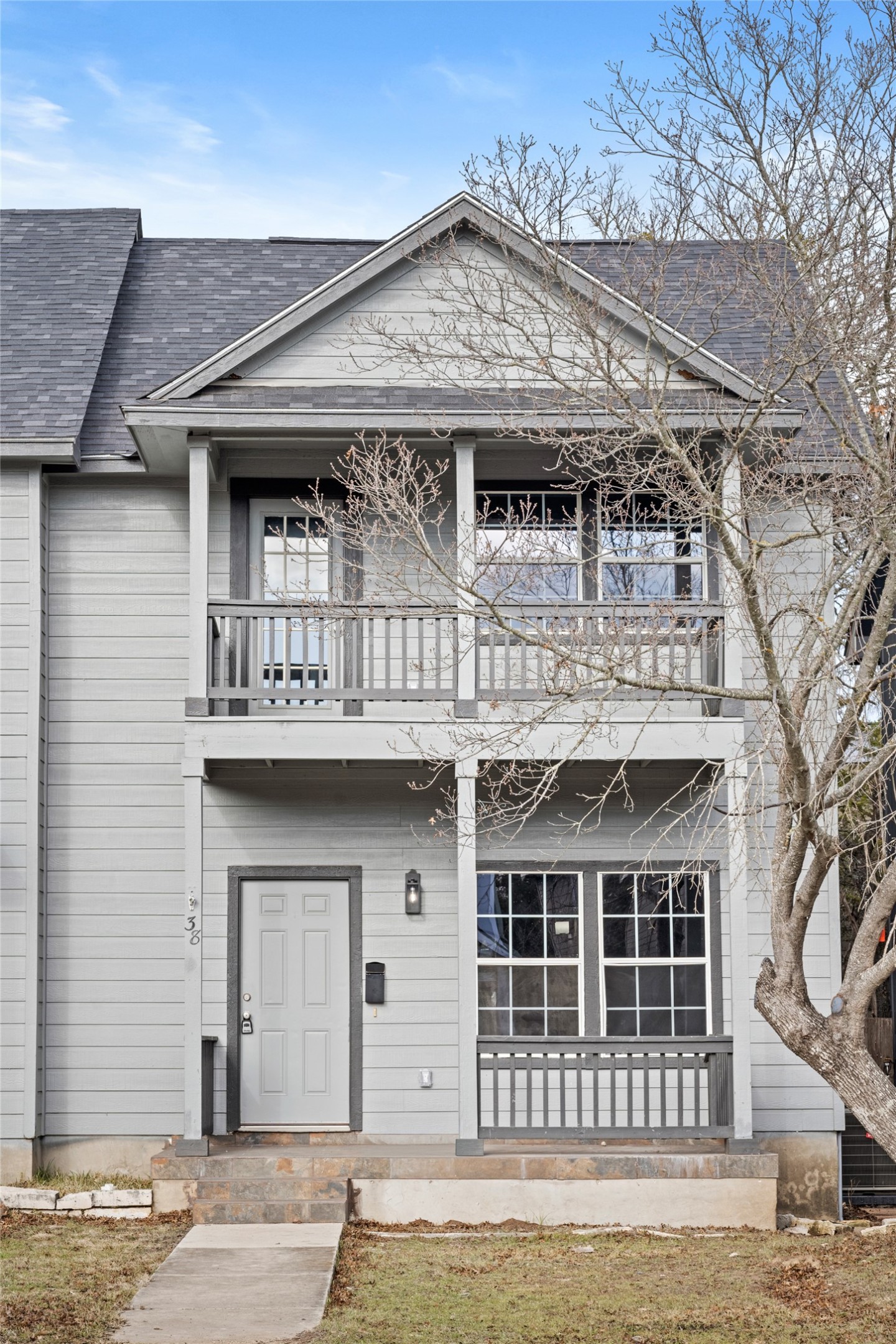 a front view of a house with a garage