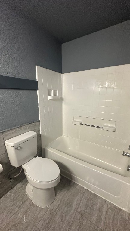 38 Deer Ridge Road Wimberley, TX 78676 - Photo 18 of 26 a white toilet sitting next to a bath tub