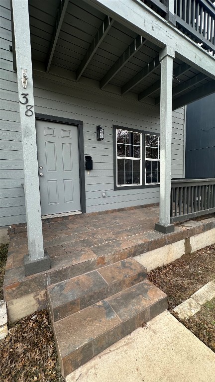 38 Deer Ridge Road Wimberley, TX 78676 - Photo 2 of 26 a front view of a house with a garage