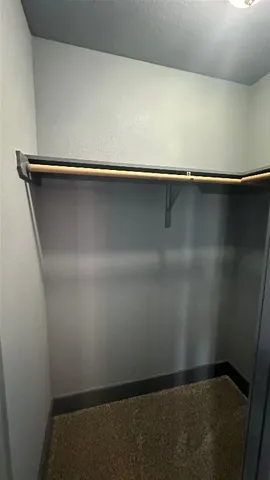 a bathroom with a double vanity sink mirror and toilet