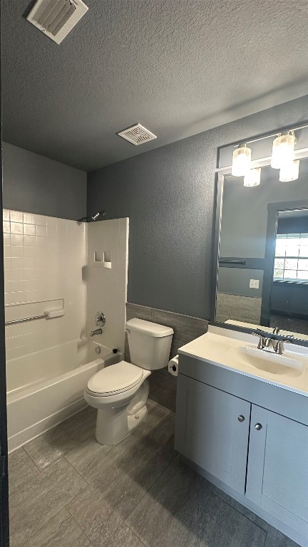 38 Deer Ridge Road Wimberley, TX 78676 - Photo 23 of 26 a bathroom with a double vanity sink mirror and toilet