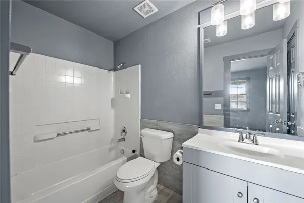a bathroom with a double vanity sink and mirror