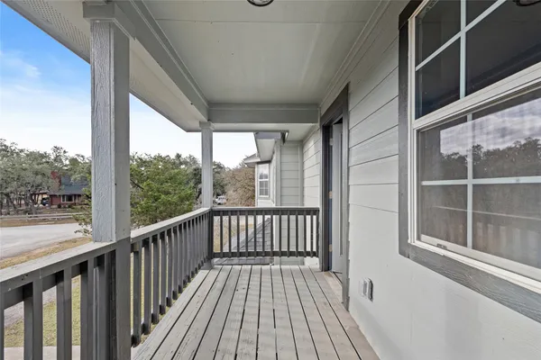 a backyard of a house with wooden floor