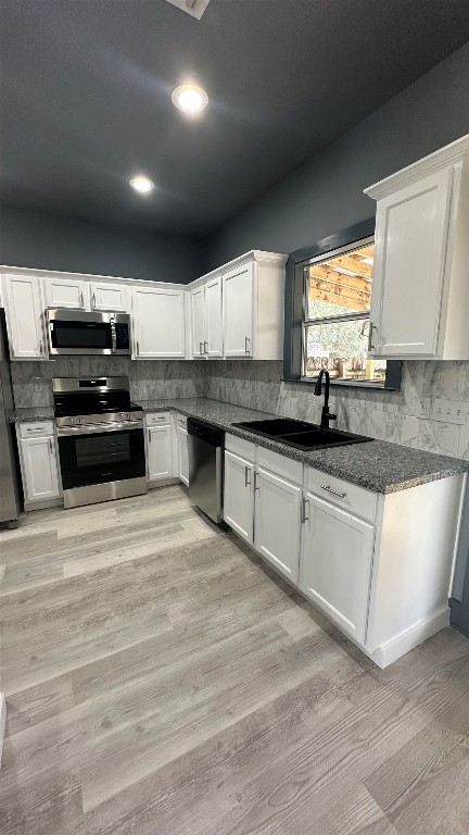 38 Deer Ridge Road Wimberley, TX 78676 - Photo 8 of 26 a kitchen with stainless steel appliances granite countertop a sink and a stove