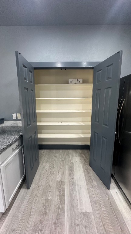 38 Deer Ridge Road Wimberley, TX 78676 - Photo 10 of 26 a view of walk in closet with clothes and shoes