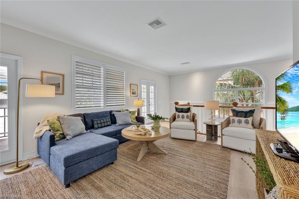 255 2nd Avenue North Naples, FL 34102 - Photo 11 of 32 a living room with furniture and a large window