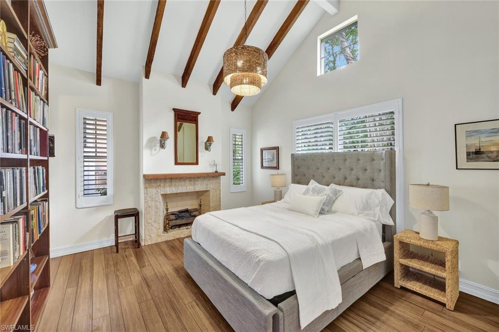 255 2nd Avenue North Naples, FL 34102 - Photo 17 of 32 a bedroom with a bed and a couch