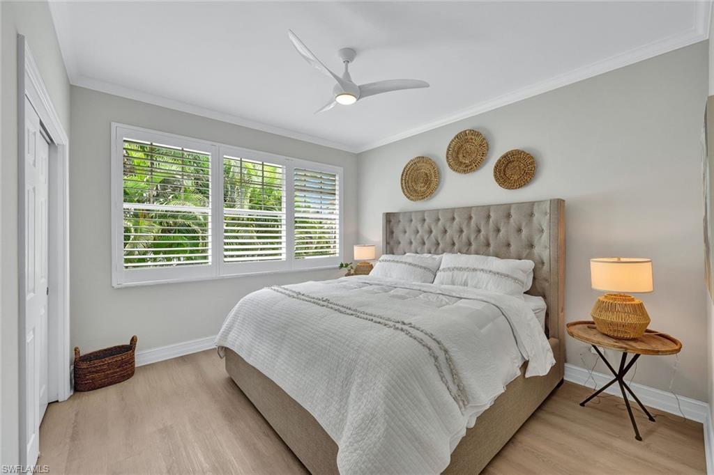 255 2nd Avenue North Naples, FL 34102 - Photo 19 of 32 a bedroom with a bed and a window