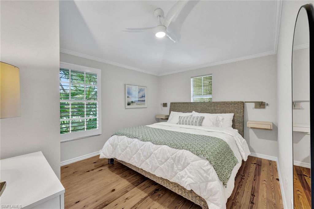 255 2nd Avenue North Naples, FL 34102 - Photo 24 of 32 a bed room with a bed and a window