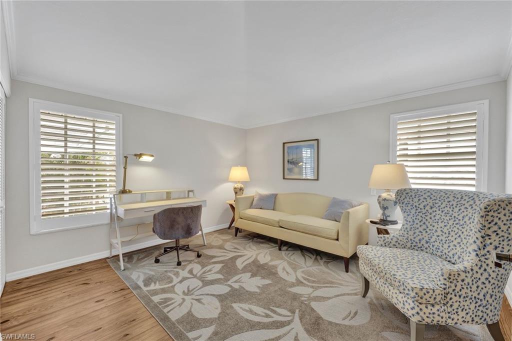 255 2nd Avenue North Naples, FL 34102 - Photo 28 of 32 a living room with furniture and a window