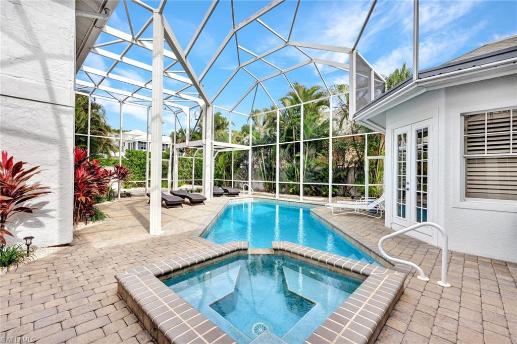 255 2nd Avenue North Naples, FL 34102 - Photo 30 of 32 a swimming pool with outdoor seating