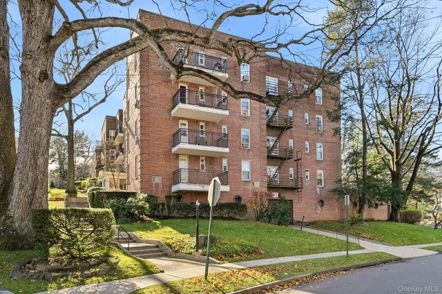 a view of a building with a yard