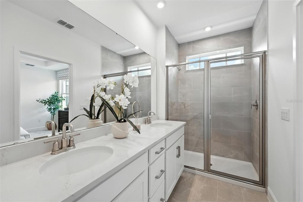 1475 Seashore Circle Celebration, FL 34747 - Photo 13 of 31 a bathroom with a sink and a mirror