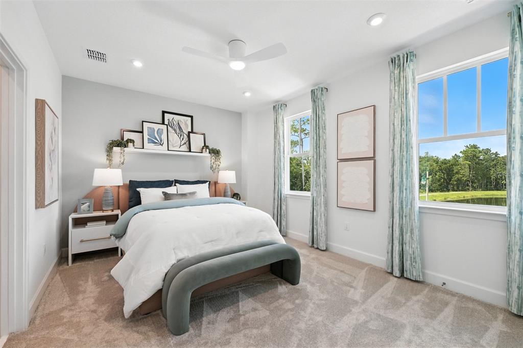 1475 Seashore Circle Celebration, FL 34747 - Photo 15 of 31 a bedroom with a bed and a window