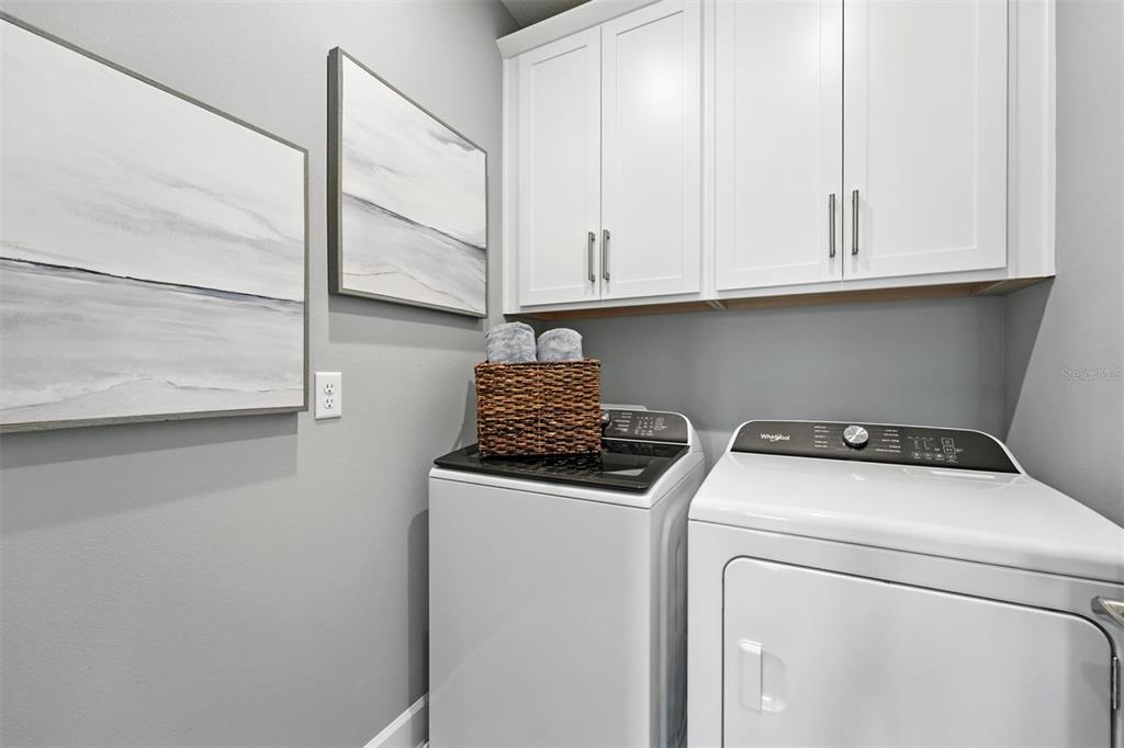 1475 Seashore Circle Celebration, FL 34747 - Photo 20 of 31 a utility room with dryer and washer