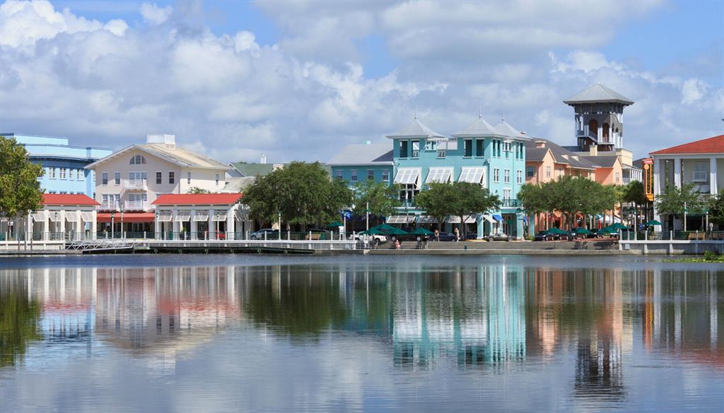 1475 Seashore Circle Celebration, FL 34747 - Photo 30 of 31 a front view of a building with river and outdoor seating