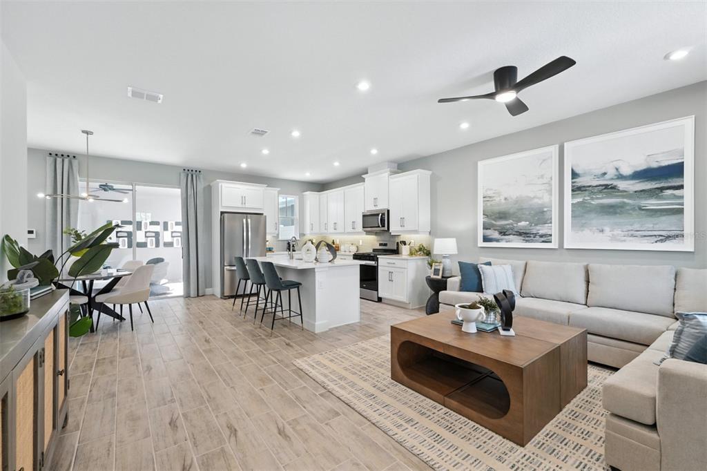 1475 Seashore Circle Celebration, FL 34747 - Photo 7 of 31 a living room with furniture kitchen and a large window