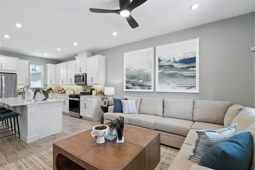 1475 Seashore Circle Celebration, FL 34747 - Photo 9 of 31 a living room with furniture and a large window