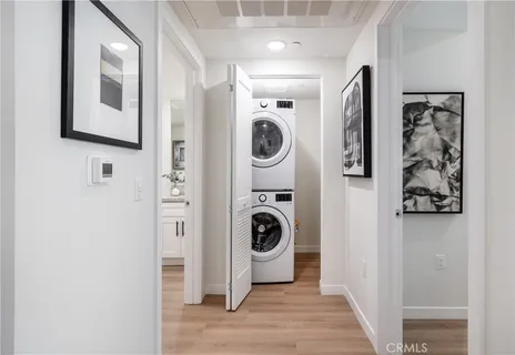 a view of a hallway with washer and dryer