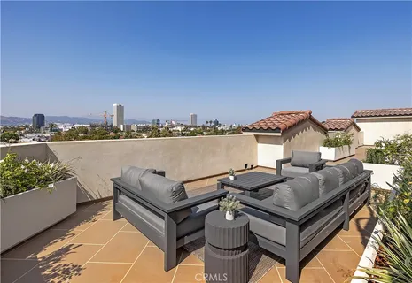 a view of a terrace with chairs