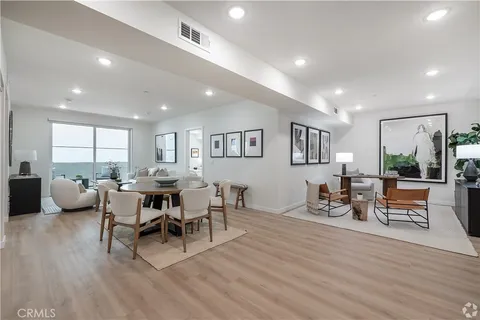 a view of a dining room with furniture window and wooden floor