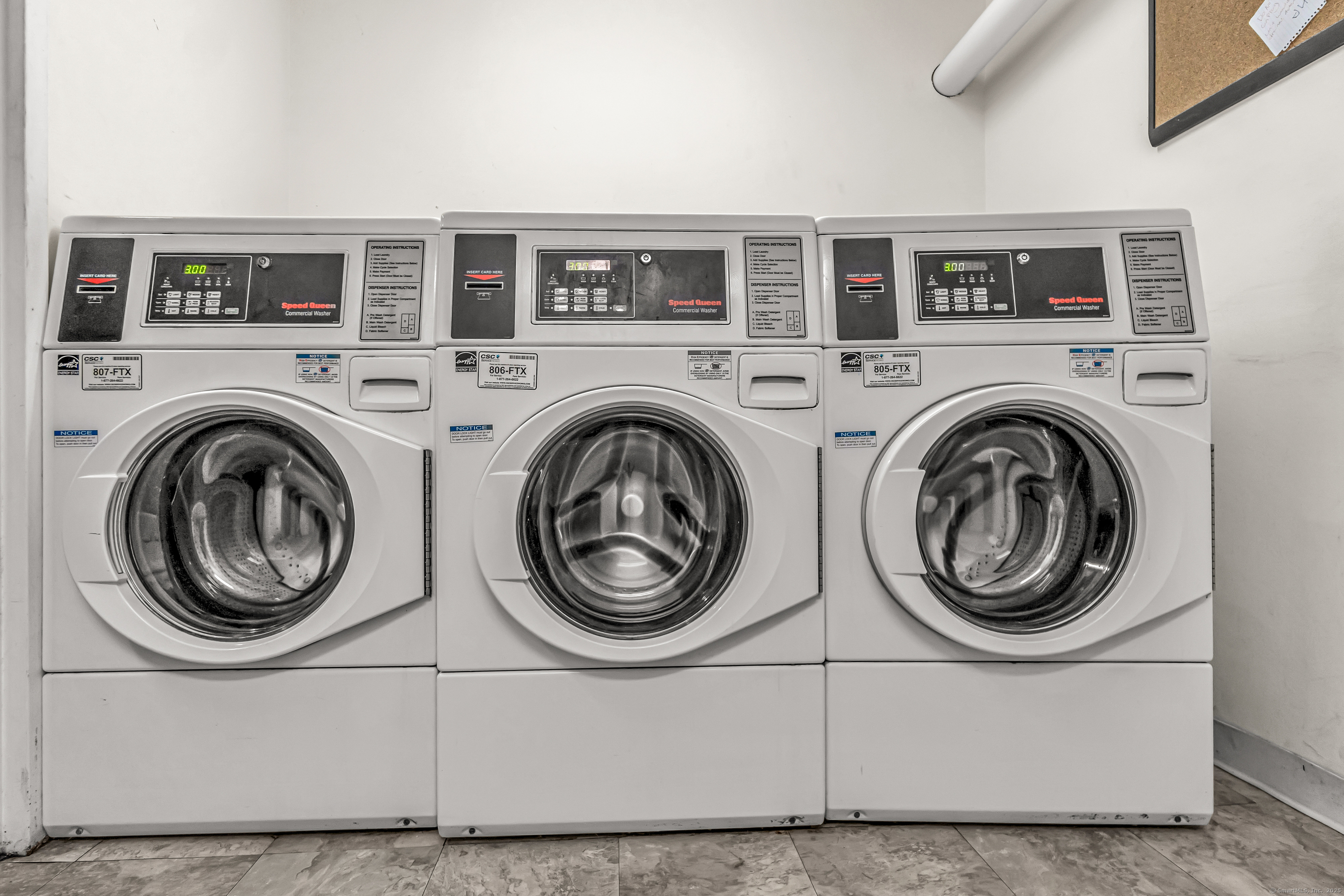 115 Short Beach Road, Unit 103 Stratford, CT 06615 - Photo 16 of 18 a view of entryway with washer and dryer