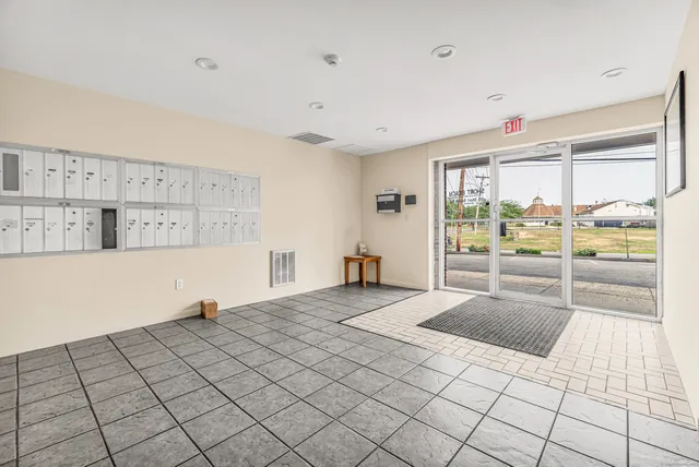 a room with a bed and a large window