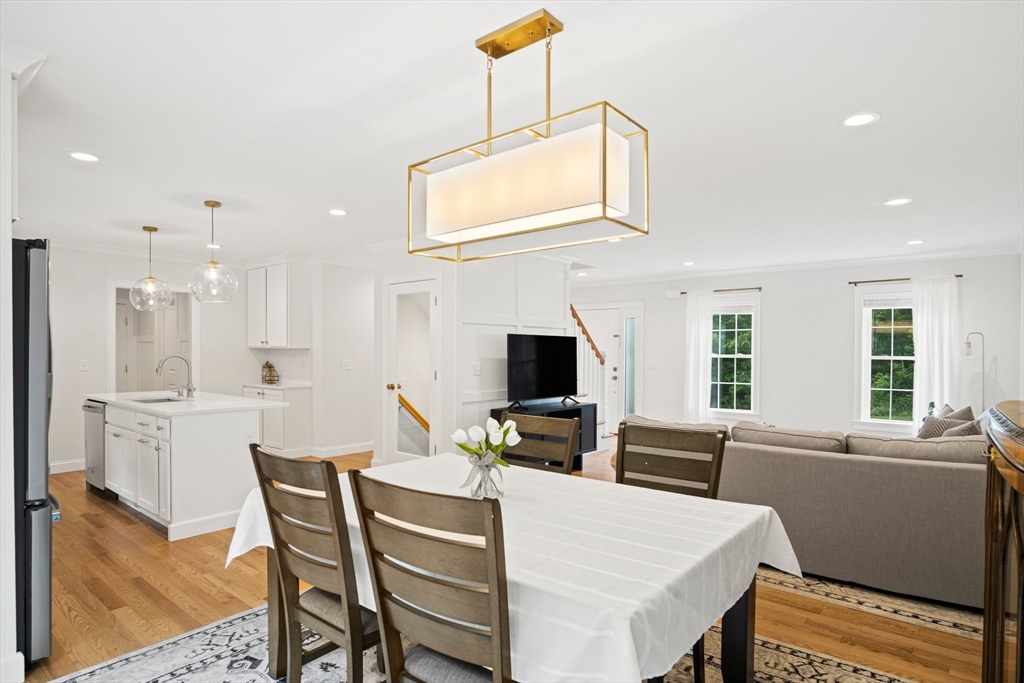 6 Sandy Pond Road Ayer, MA 01432 - Photo 12 of 37 a living room with furniture a fireplace and a flat screen tv
