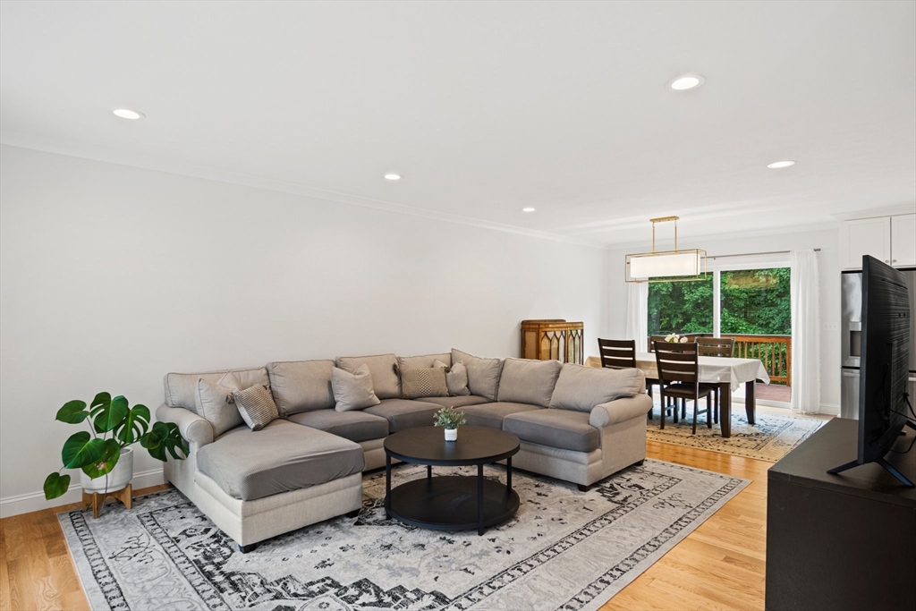 6 Sandy Pond Road Ayer, MA 01432 - Photo 14 of 37 a living room with furniture flat screen tv and a large window