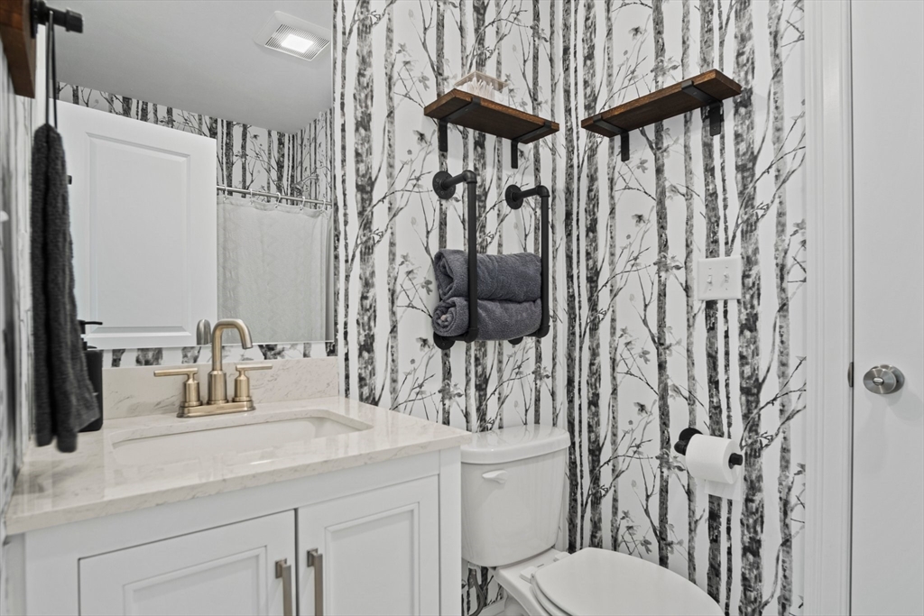 6 Sandy Pond Road Ayer, MA 01432 - Photo 18 of 37 a bathroom with a sink a toilet and shower