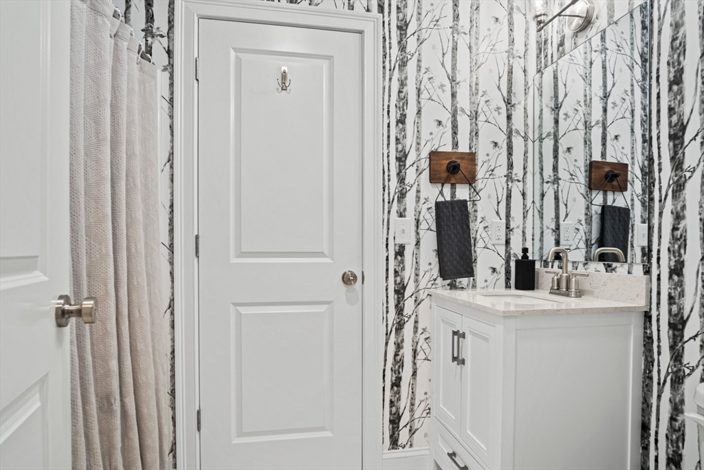 6 Sandy Pond Road Ayer, MA 01432 - Photo 19 of 37 wooden floor with a mirror