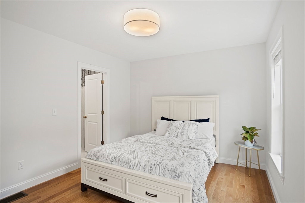 6 Sandy Pond Road Ayer, MA 01432 - Photo 20 of 37 a bedroom with a bed and a window