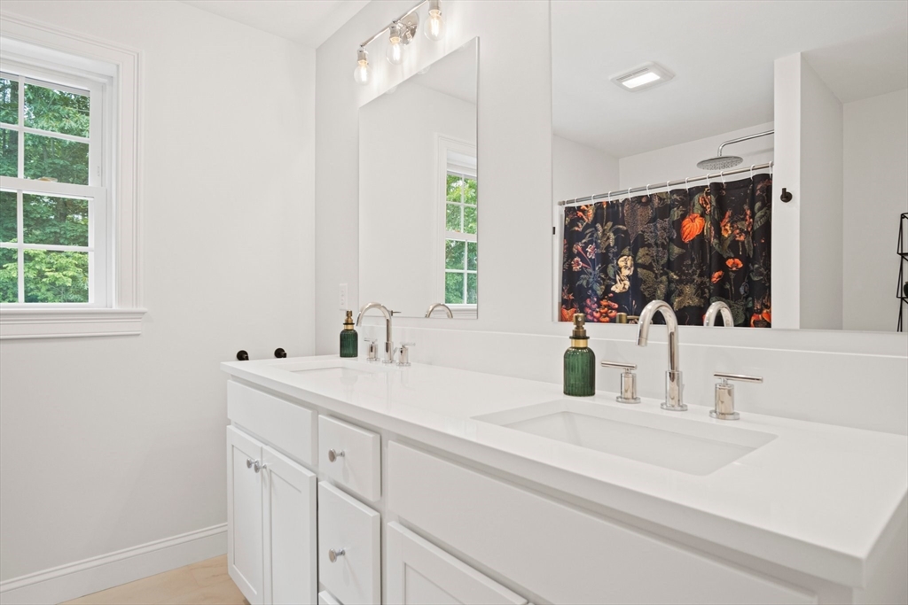 6 Sandy Pond Road Ayer, MA 01432 - Photo 24 of 37 a bathroom with a double vanity sink mirror and window