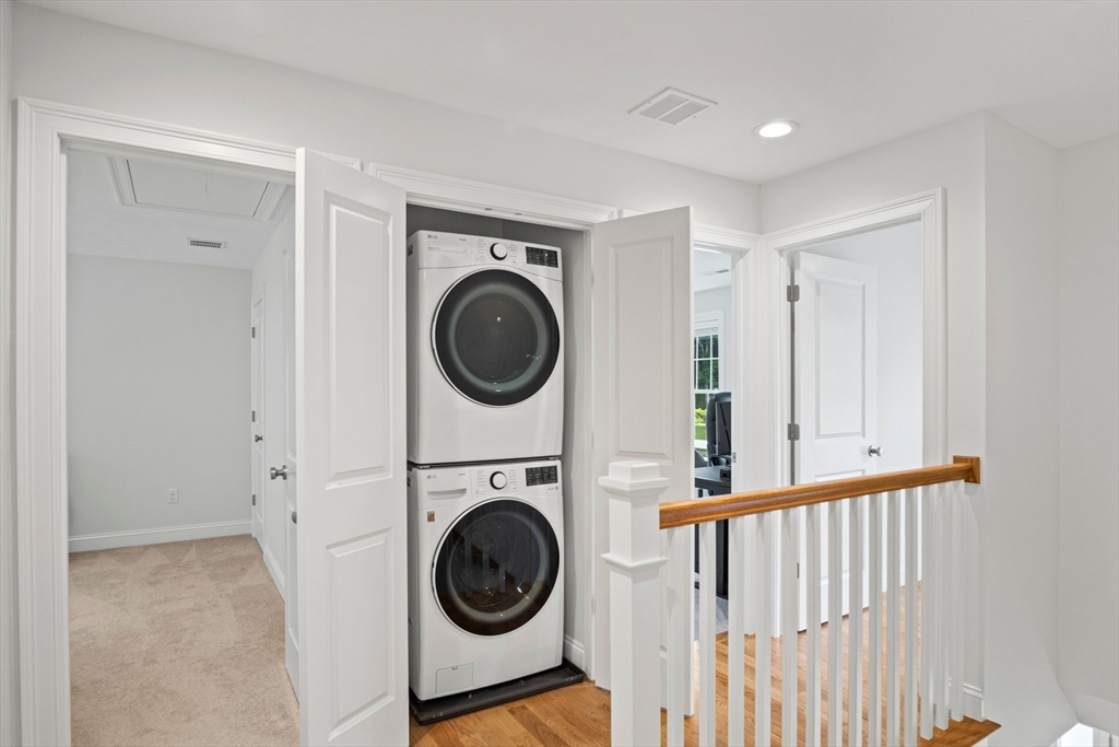 6 Sandy Pond Road Ayer, MA 01432 - Photo 28 of 37 a view of a hallway with washer and dryer