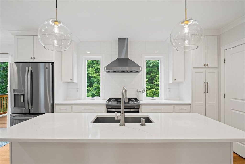 6 Sandy Pond Road Ayer, MA 01432 - Photo 3 of 37 a kitchen with a chandelier and a sink