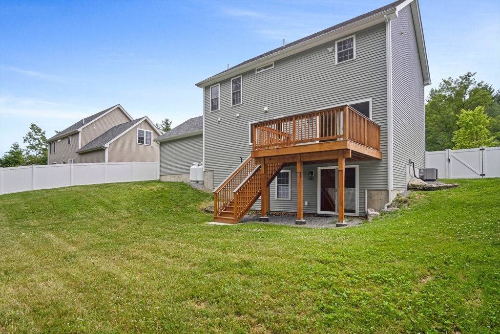 6 Sandy Pond Road Ayer, MA 01432 - Photo 31 of 37 a view of a house with a yard