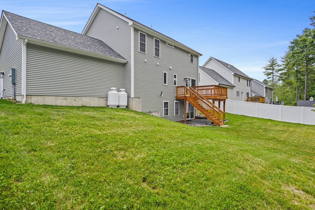 6 Sandy Pond Road Ayer, MA 01432 - Photo 32 of 37 a view of a house with a backyard