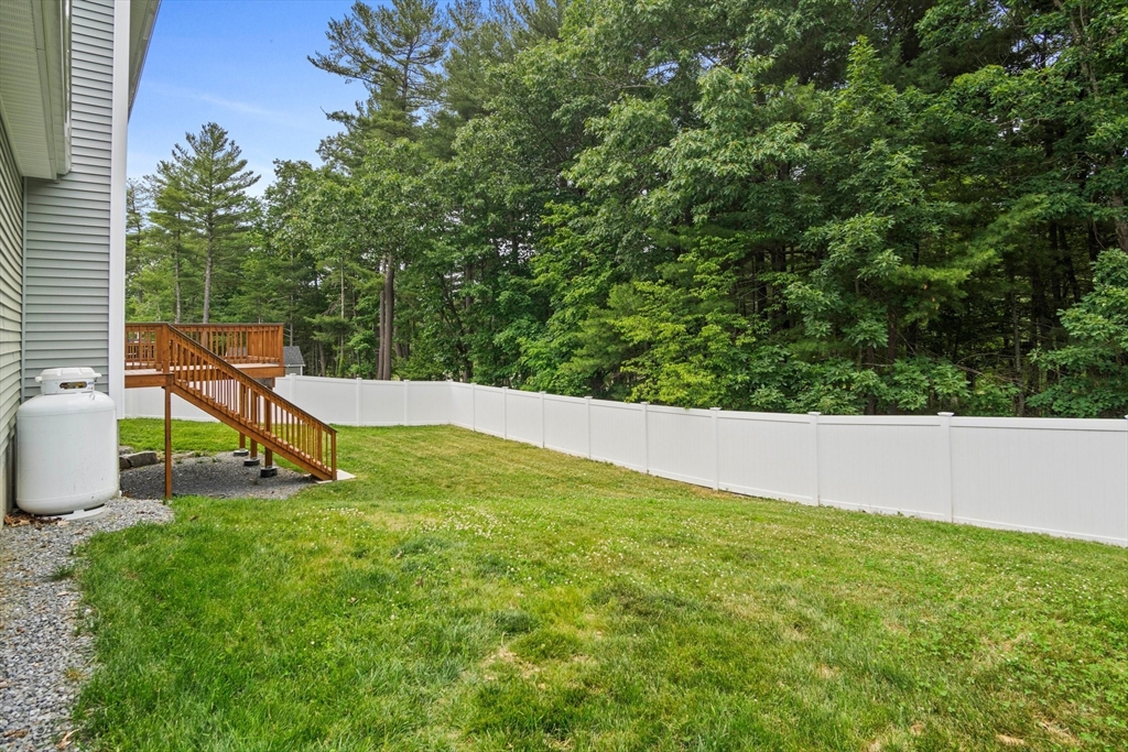 6 Sandy Pond Road Ayer, MA 01432 - Photo 33 of 37 a view of a backyard with plants and garden
