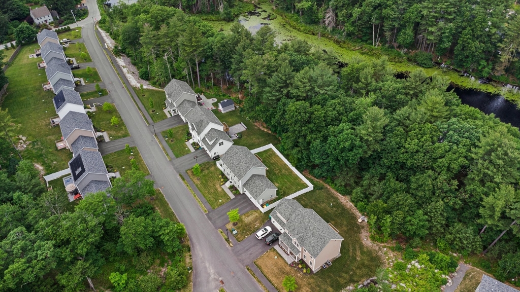 6 Sandy Pond Road Ayer, MA 01432 - Photo 36 of 37 an aerial view of a house with a yard
