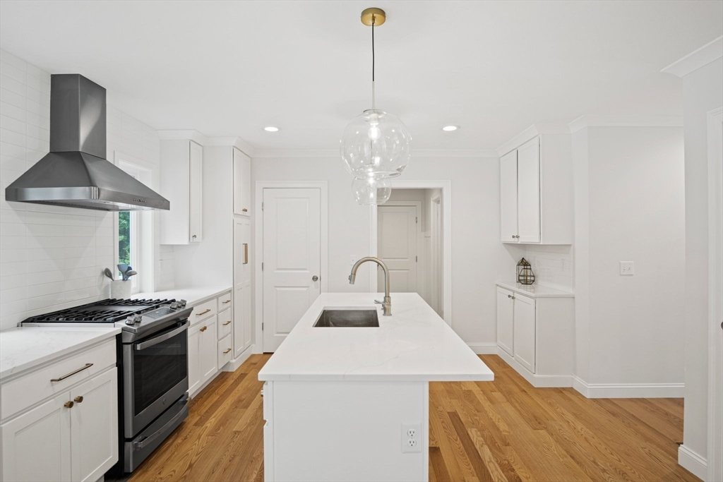 6 Sandy Pond Road Ayer, MA 01432 - Photo 4 of 37 a kitchen with granite countertop a sink stainless steel appliances and cabinets