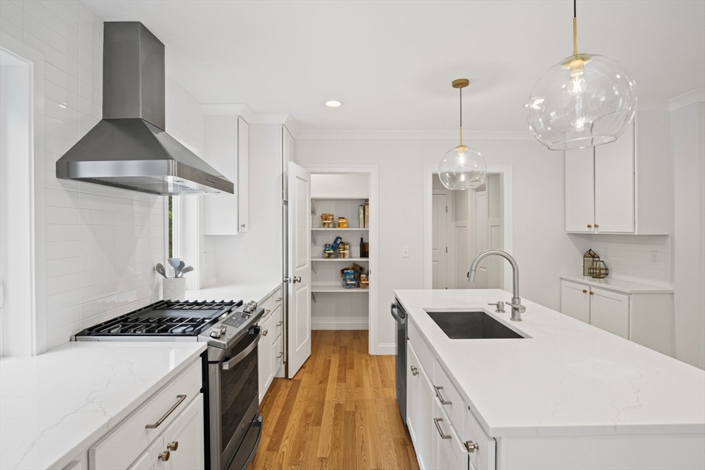 6 Sandy Pond Road Ayer, MA 01432 - Photo 6 of 37 a kitchen that has a lot of cabinets a sink and a stove