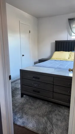 a room with a dresser