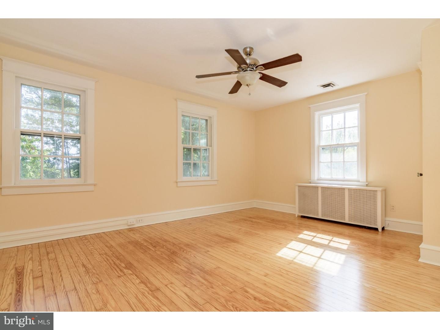 35 State Road Avondale, PA 19311 - Photo 12 of 25 a view of an empty room with a window and wooden floor