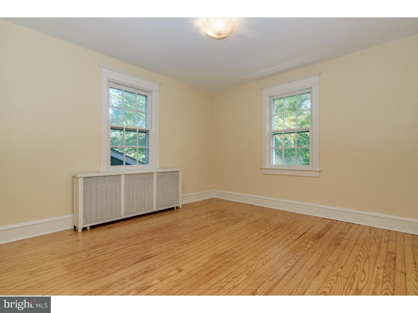 35 State Road Avondale, PA 19311 - Photo 13 of 25 an empty room with wooden floor and windows