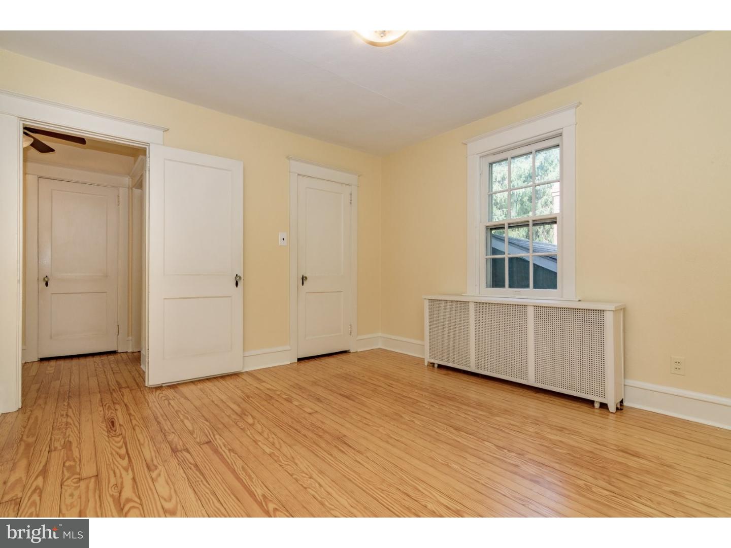 35 State Road Avondale, PA 19311 - Photo 14 of 25 a view of an empty room with wooden floor and a window