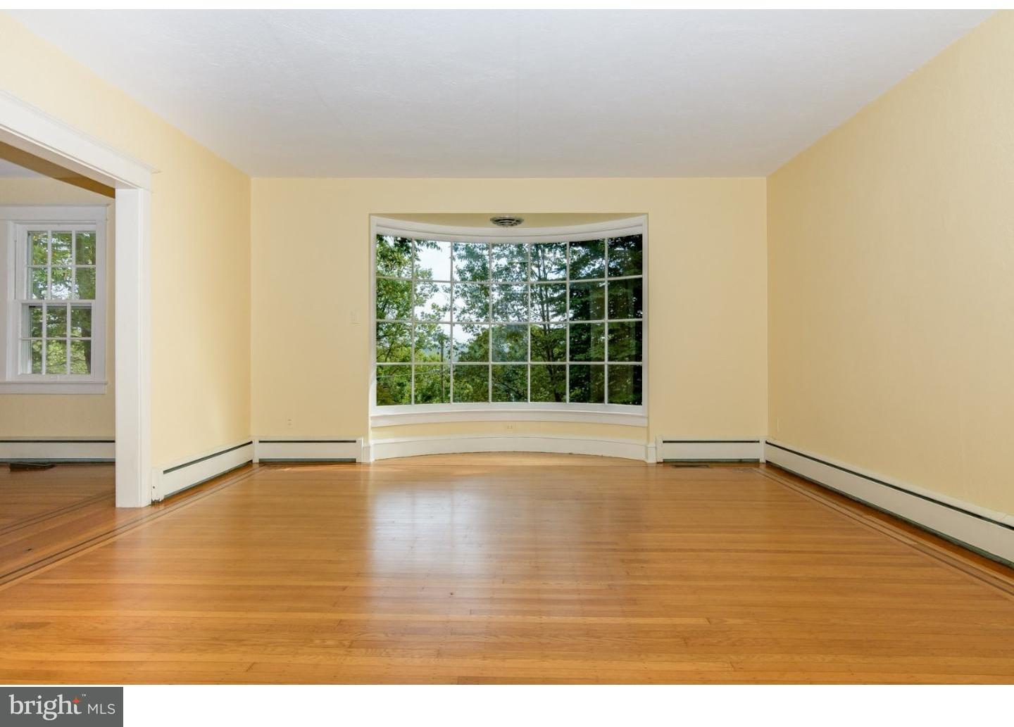 35 State Road Avondale, PA 19311 - Photo 6 of 25 a view of an empty room with wooden floor and a window