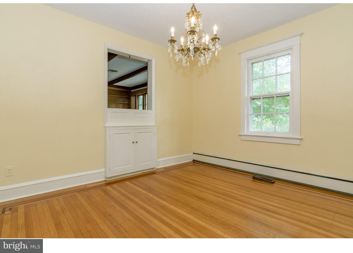 35 State Road Avondale, PA 19311 - Photo 7 of 25 an empty room with wooden floor chandelier and windows