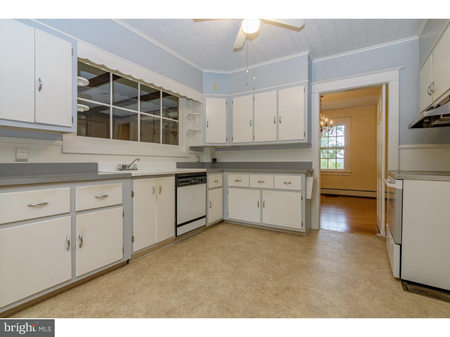 35 State Road Avondale, PA 19311 - Photo 8 of 25 a kitchen with a sink stove and cabinets