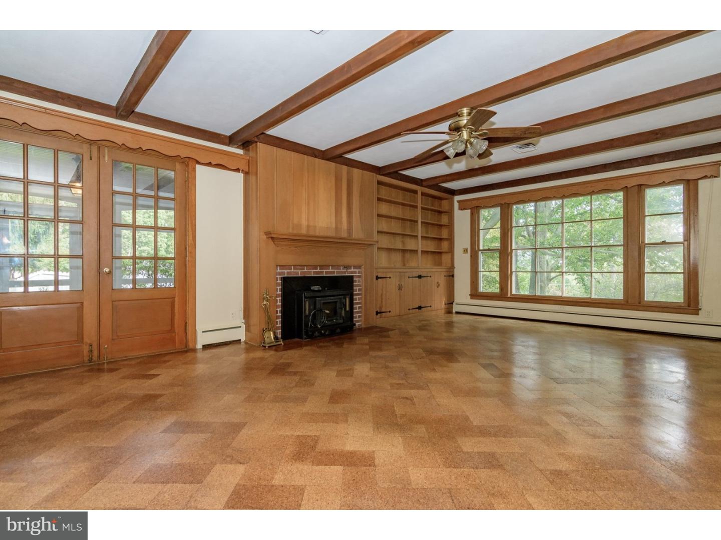35 State Road Avondale, PA 19311 - Photo 10 of 25 a view of an empty room with a fireplace and a window